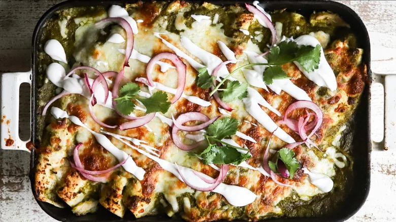 Chicken enchiladas in baking dish