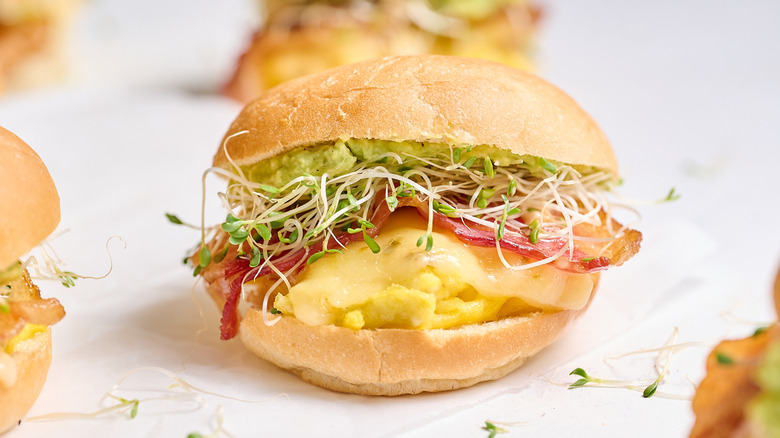 Breakfast slider with egg, bacon, and alfalfa sprouts