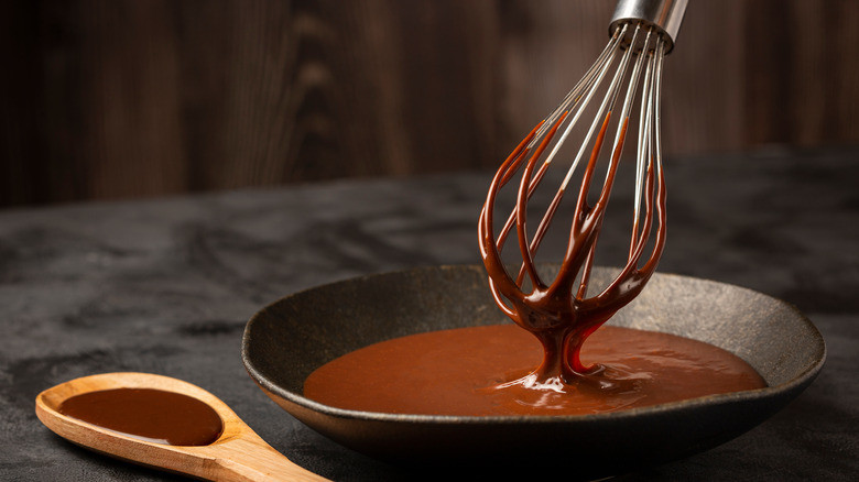 delicious chocolate ganache with whisk