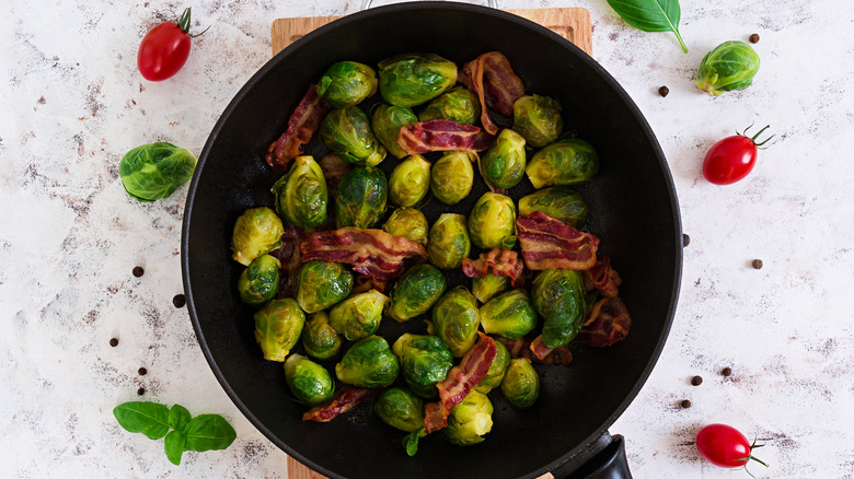 Bacon and roasted Brussels sprouts in a cast iron skillet