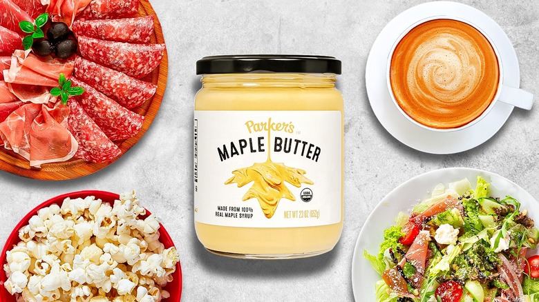 jar of maple butter surrounded by charcuterie, popcorn, salad, and latte