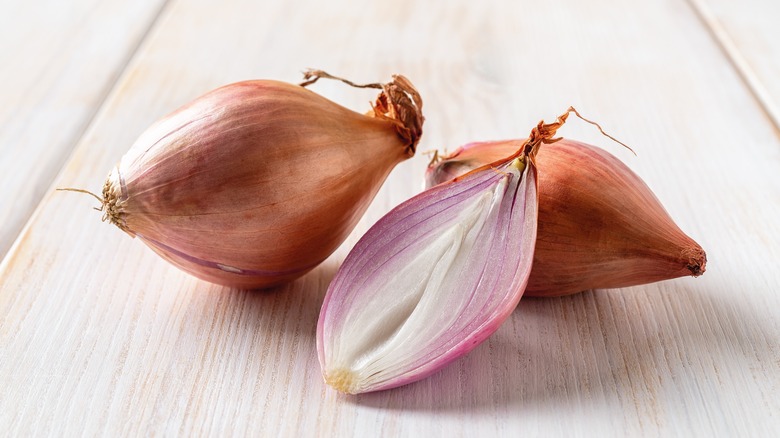 Shallots on wooden table