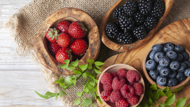 Wooden bowls of berries