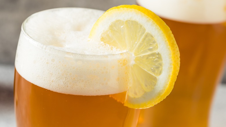 Beer with lemon wedge