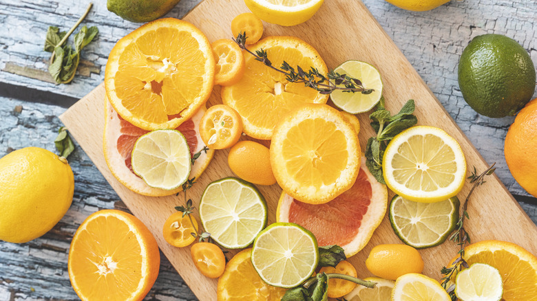 citrus fruits on cutting board