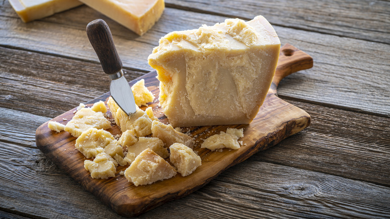 Parmesan cheese on cutting board