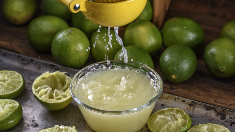 Lime juice squeezing into container