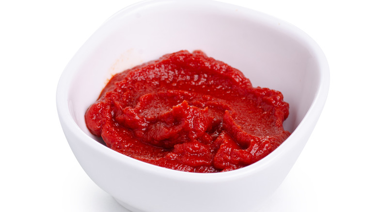 Tomato paste in white bowl