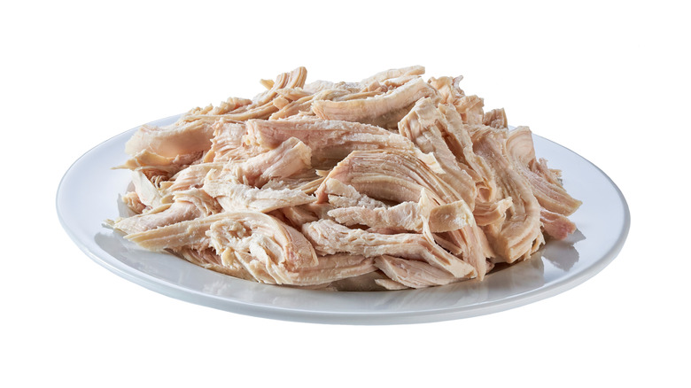 Shredded chicken on white plate