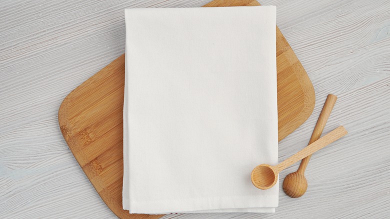 Towel on wooden cutting board