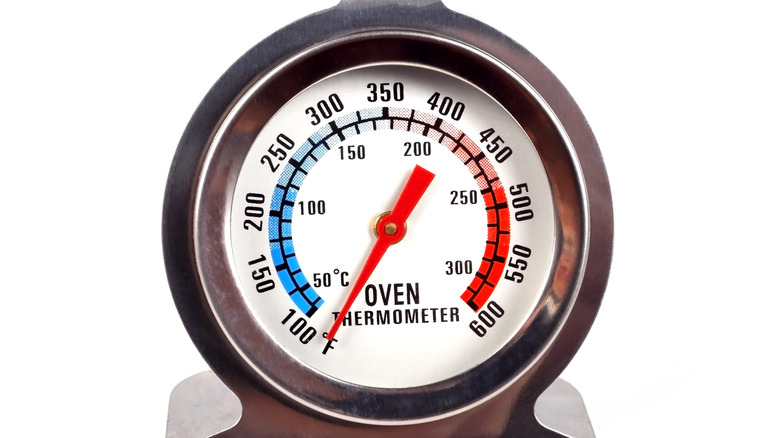 Oven thermometer on white background