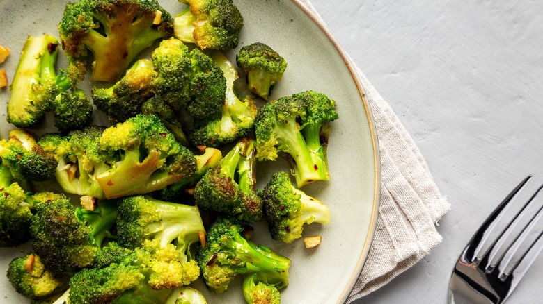 browned broccoli florets on plate 