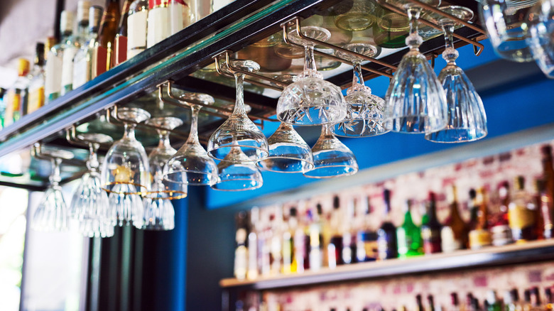 Pub, drink, and glassware hanging at club room interior