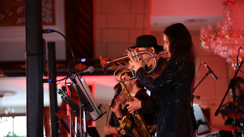 Concert jazz band playing on stage on brass trumpet saxophone