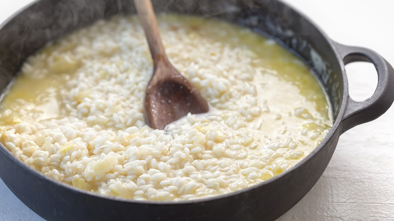 Risotto in pot with spoon