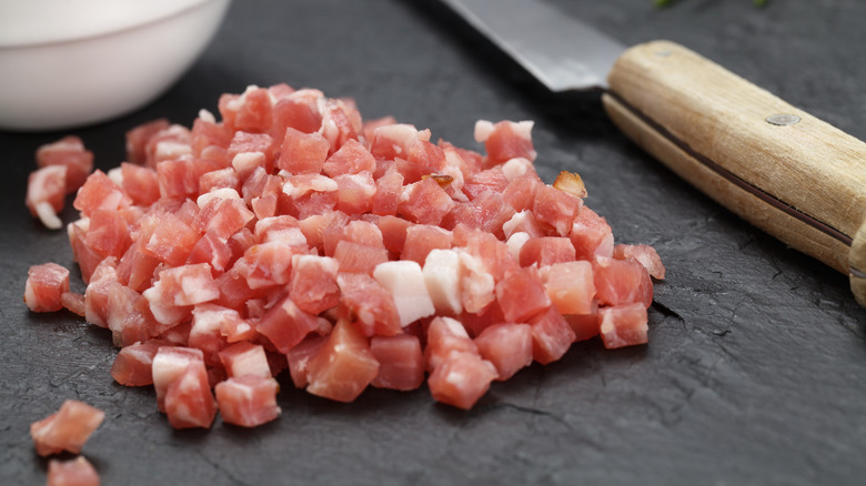 Diced ham with knife