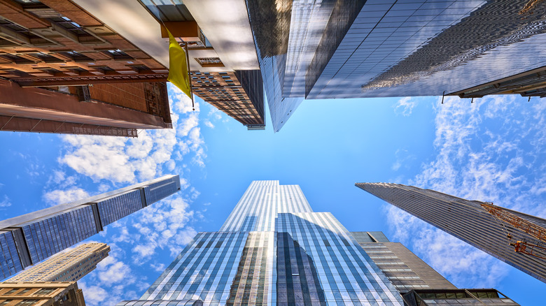 Sky, looking up, surrounded skyscrapers