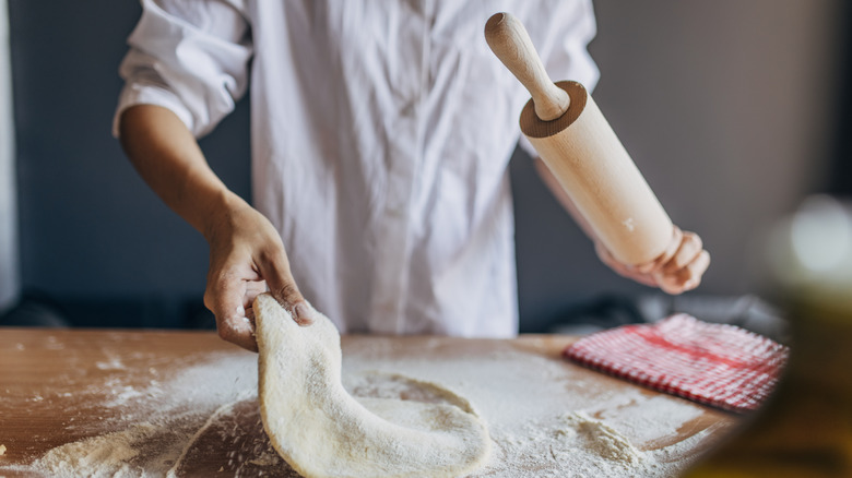 Person rolling out dough