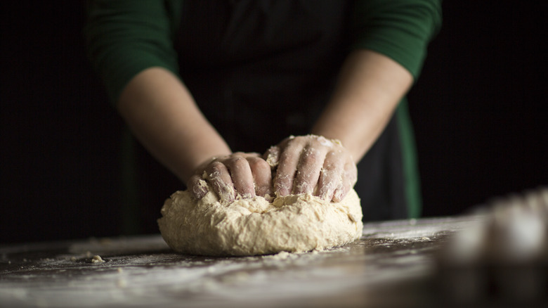 Person kneading dough