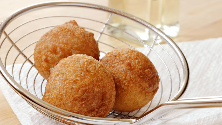 Fried donut balls in strainer