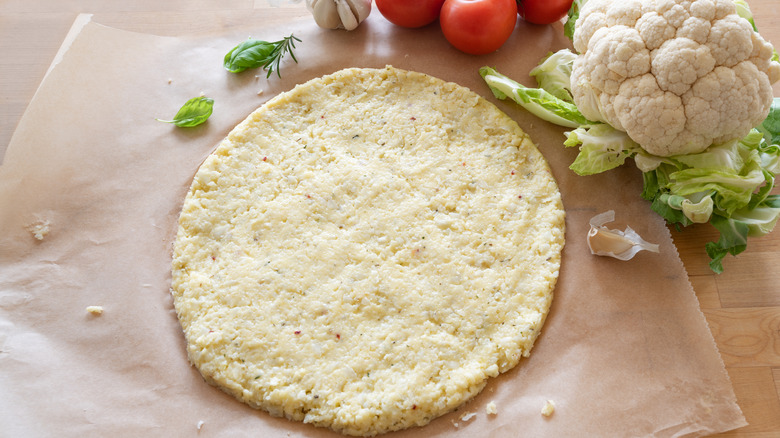 Cauliflower pizza crust on paper