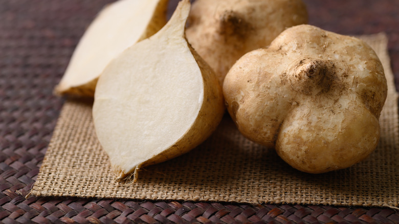 Whole jicama on table