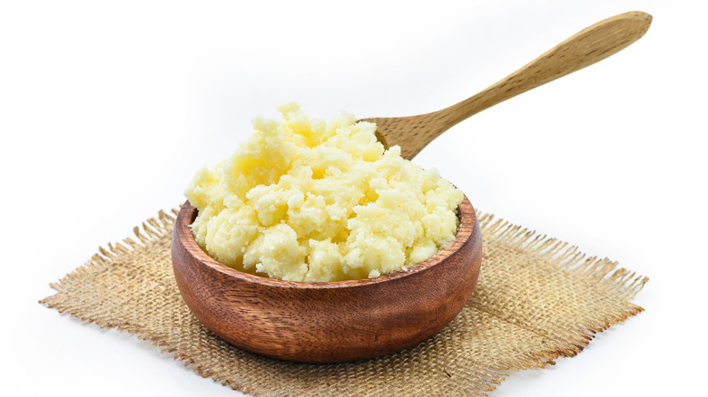 Clarified butter in wooden bowl