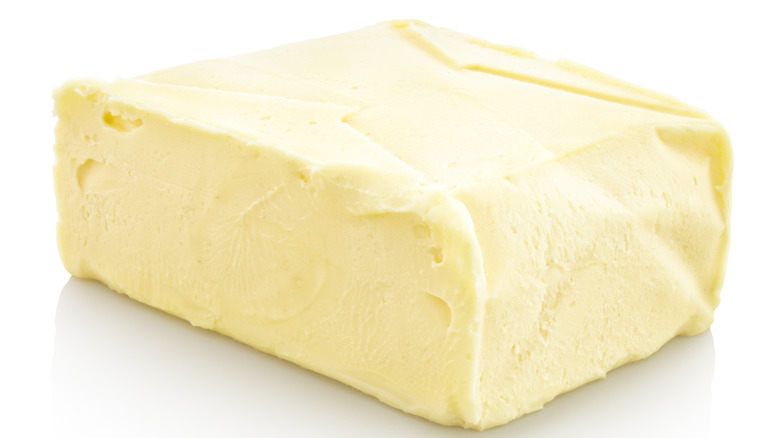 Butter block on white background