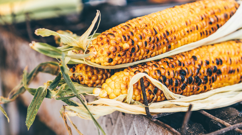 Three charred ears of corn