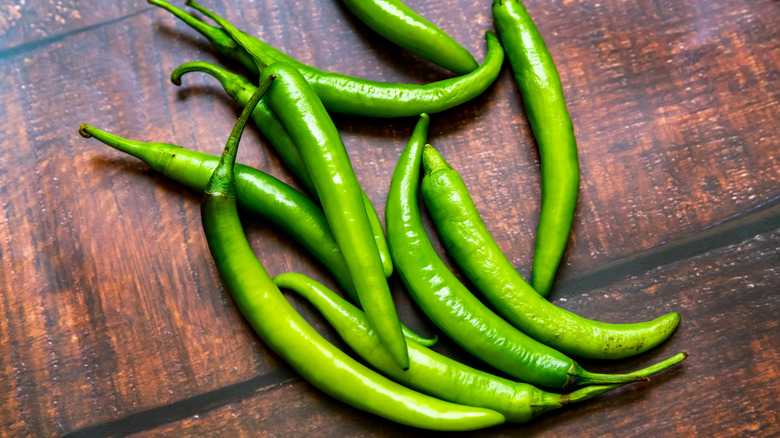 Hatch green chiles on wooden table