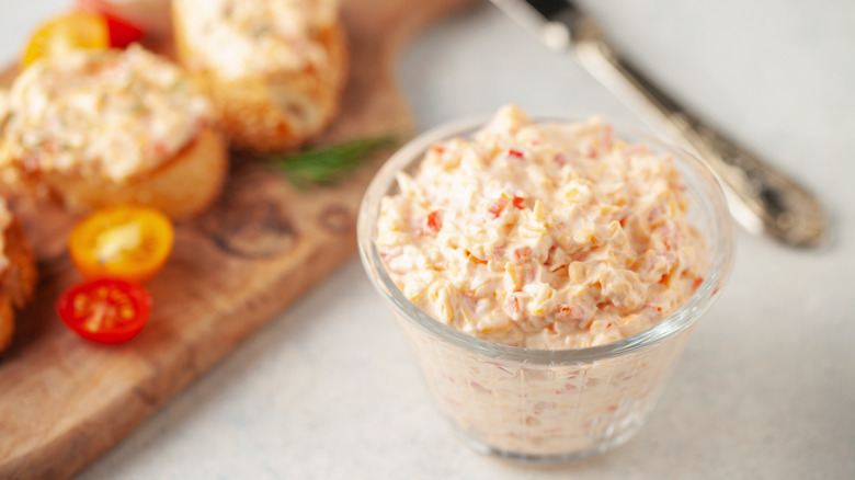 Homemade pimento cheese on wooden cutting board