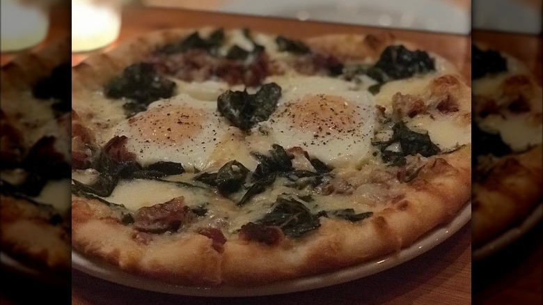 Pizza topped with collard greens