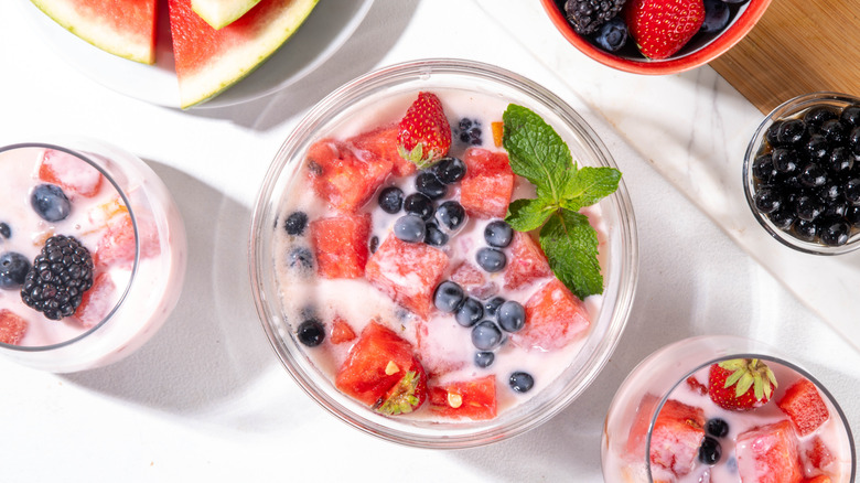 bowl of hwachae surrounded by fruits