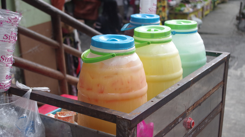colorful containers of sago't gulaman with lids