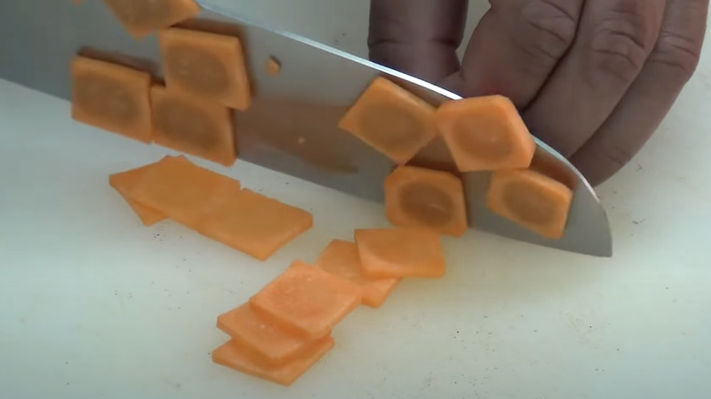 Cutting paysanne style carrots