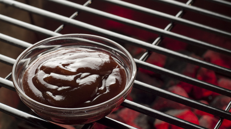 BBQ sauce bowl on grill