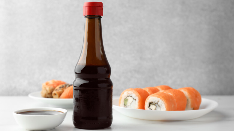 Bottle of soy sauce and sushi