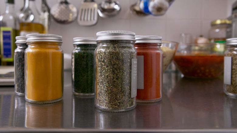 Dried herbs and spices on counter