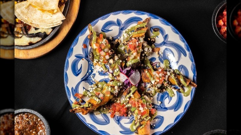 Shrimp taquitos on decorative plate