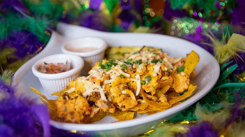 Feather boas surrounding crawfish migas