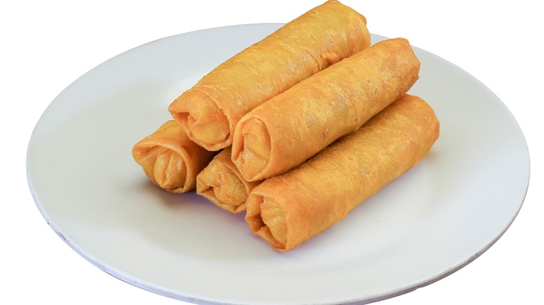 Egg roll wraps on white plate