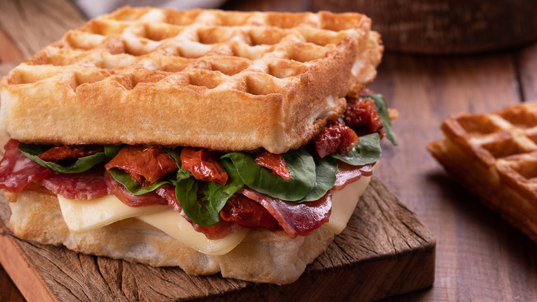 Waffle sandwich with cheese and tomatoes