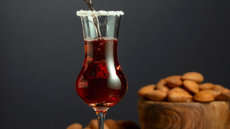 glass of amaretto liqueur with almonds