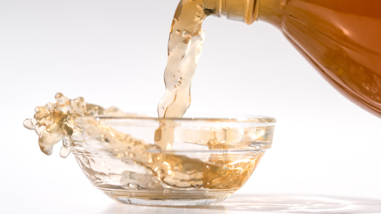 vinegar pouring into small bowl