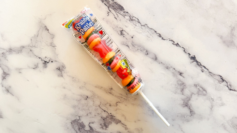 Krabby Patty skewer on marble background