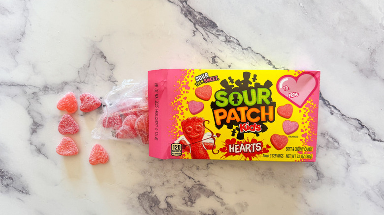 Sour Patch Kids hearts candy on marble background