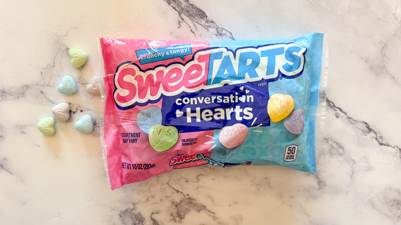 SweeTarts conversation hearts on marble surface