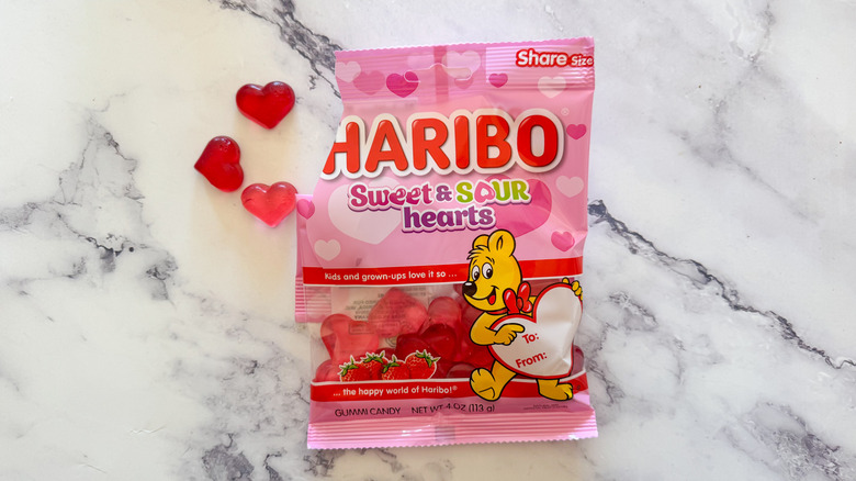 Haribo sweet and sour hearts on a marble tabletop