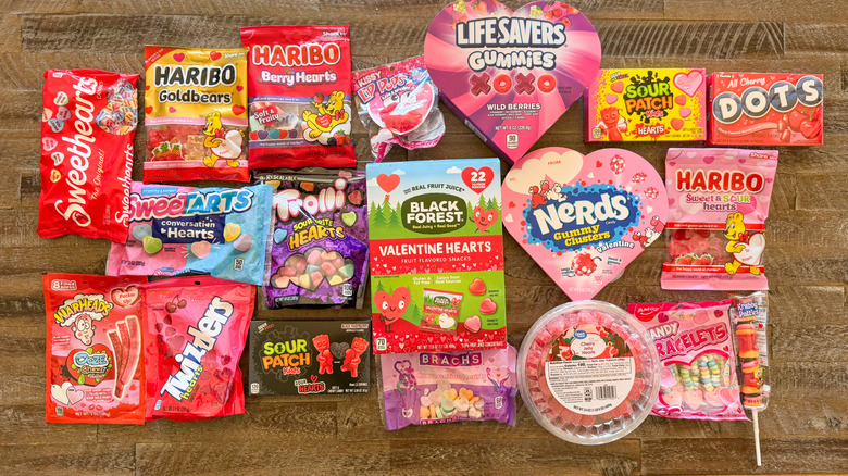 Valentine's Day candies laid out on wooden background