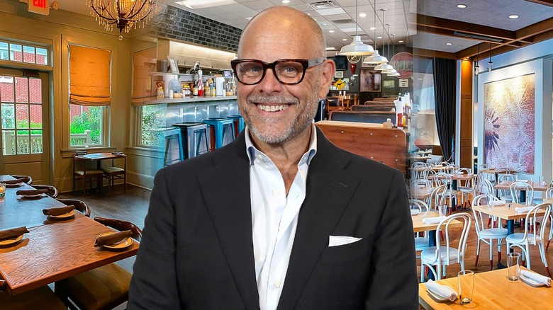 Alton Brown surrounded by restaurant dining rooms